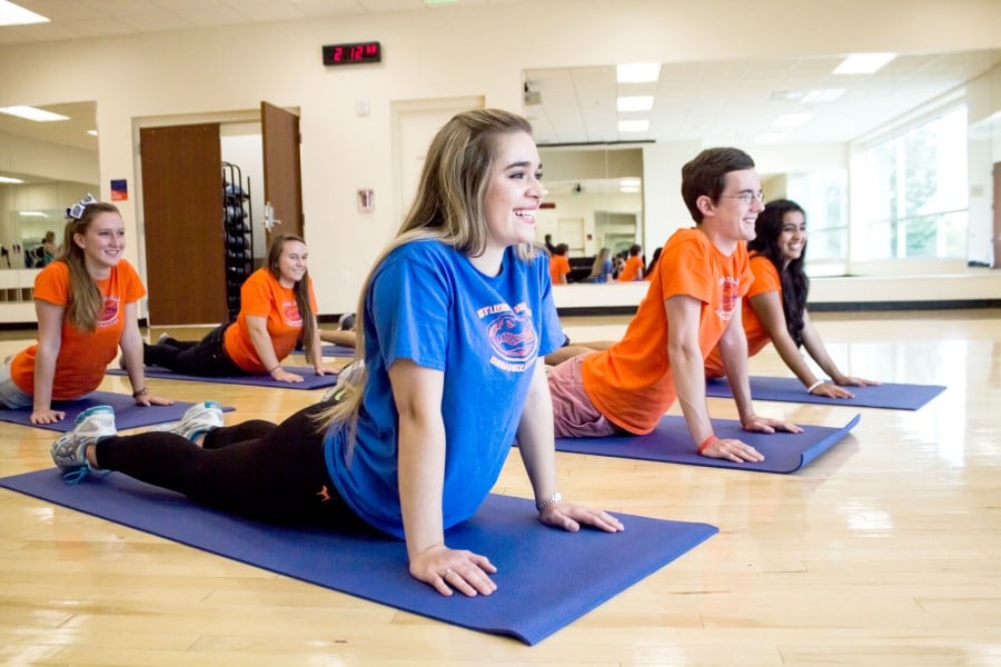 Students in a yoga group class at the UF rec center
